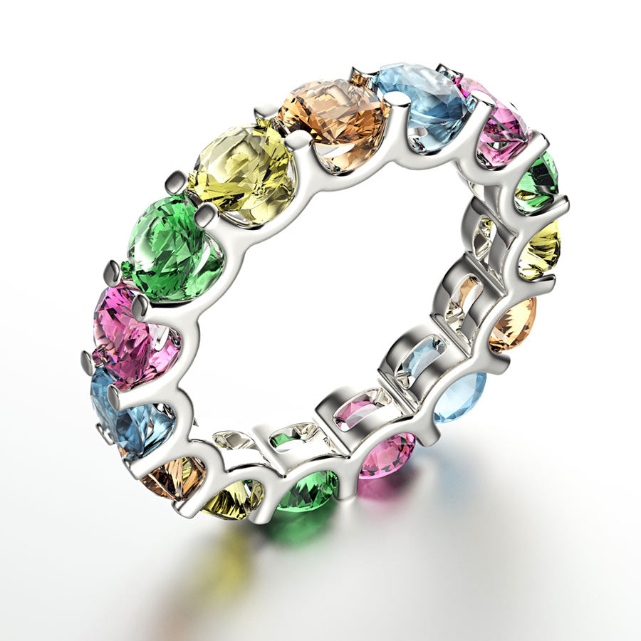 Multicolored gemstone ring on a white background