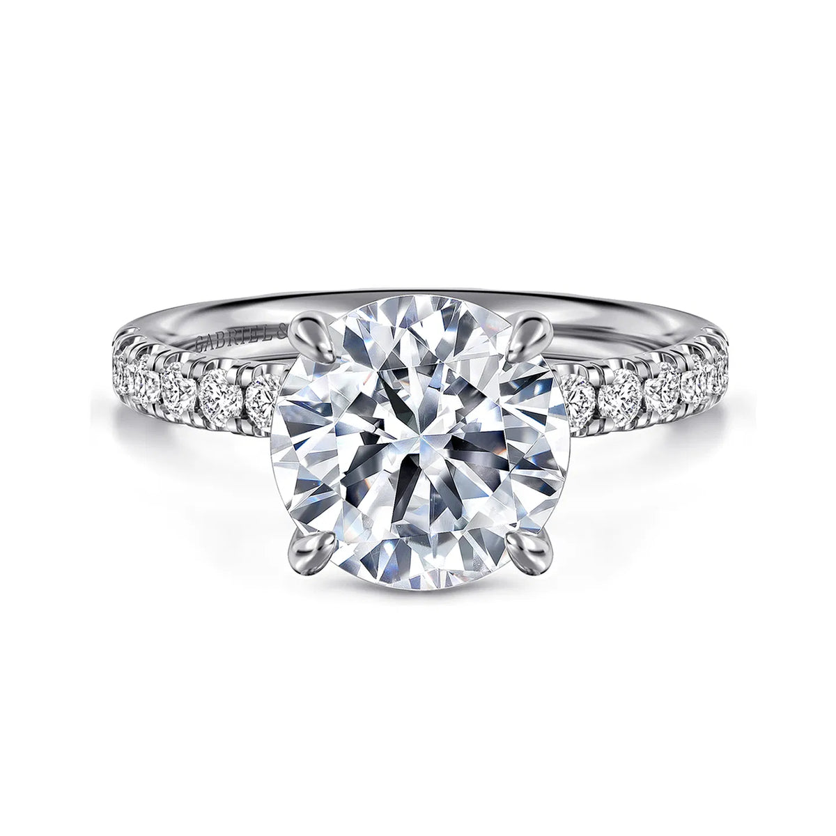 Diamond ring with a large central gemstone and smaller stones on a white background