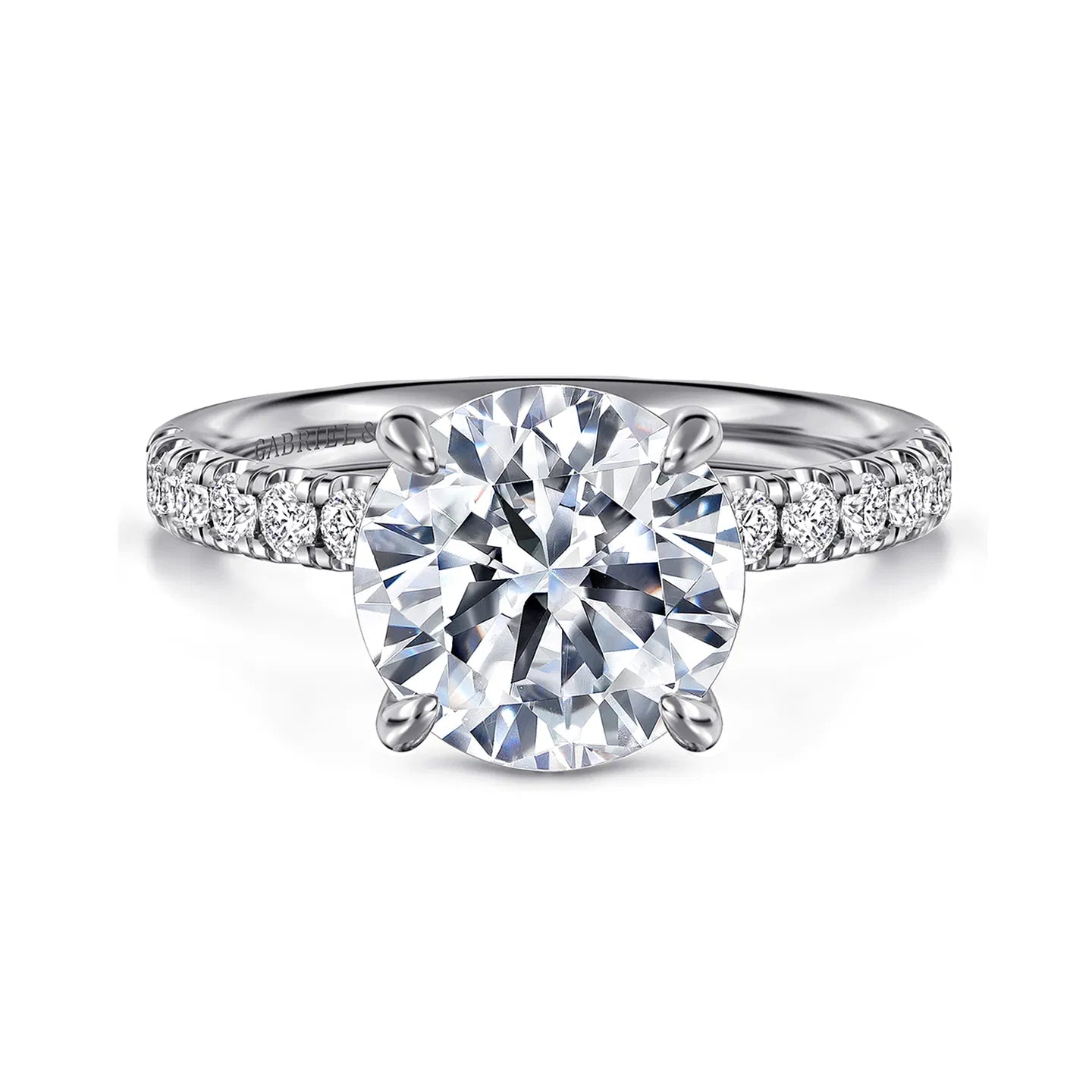 Diamond ring with a large central gemstone and smaller stones on a white background